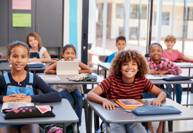 Children on devices in the classroom.png